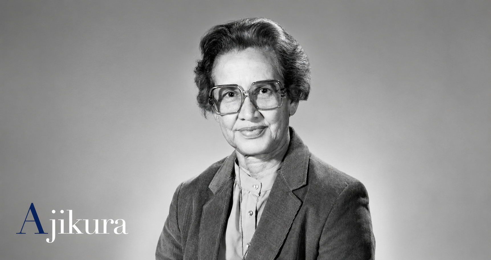 Black-and-white portrait of Joylette Goble wearing glasses and a blazer